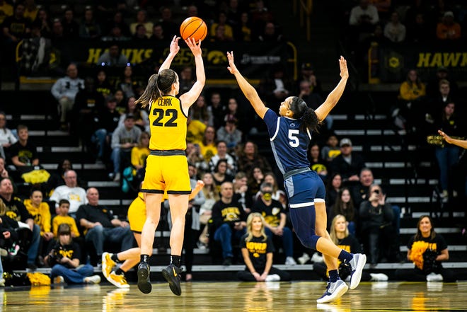 Iowa guard Caitlin Clark (22) shoots a 3-point basket as Penn State guard Leilani Kapinus defends during a NCAA Big Ten Conference women's basketball game, Saturday, Jan. 14, 2023, at Carver-Hawkeye Arena in Iowa City, Iowa.
