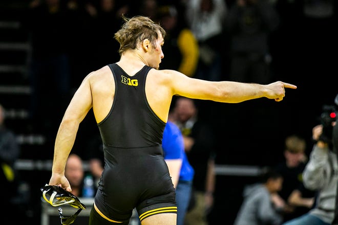 Iowa's Spencer Lee celebrates after scoring a fall at 125 pounds during a NCAA Big Ten Conference men's wrestling dual against Northwestern, Friday, Jan. 13, 2023, at Carver-Hawkeye Arena in Iowa City, Iowa.
