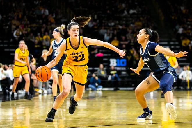 Iowa guard Caitlin Clark, left, drives to the basket as Penn State guard Leilani Kapinus defends during a NCAA Big Ten Conference women ' s basketball game, Saturday, Jan. 14, 2023, at Carver-Hawkeye Arena in Iowa City, Iowa. Iowa won, 108-67.