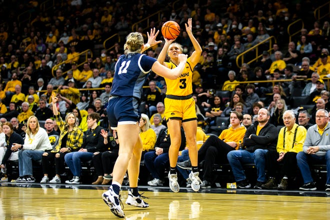 Iowa guard Sydney Affolter, right, makes a 3-point basket as Penn State forward Anna Camden defends during a NCAA Big Ten Conference women's basketball game, Saturday, Jan. 14, 2023, at Carver-Hawkeye Arena in Iowa City, Iowa.