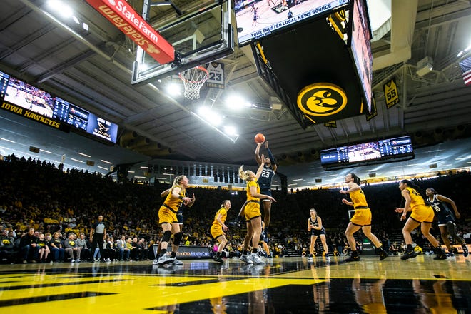 Penn State guard Taniyah Thompson (23) makes a basket as Iowa guard Sydney Affolter defends during a NCAA Big Ten Conference women's basketball game, Saturday, Jan. 14, 2023, at Carver-Hawkeye Arena in Iowa City, Iowa.