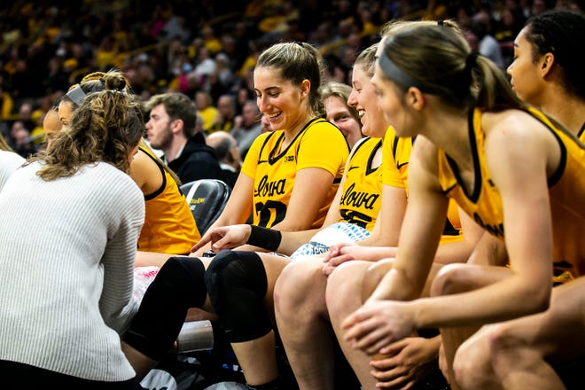 Iowa guard Kate Martin (20) gets ice applied to her knee while sitting on the bench during a NCAA Big Ten Conference women's basketball game against Penn State, Saturday, Jan. 14, 2023, at Carver-Hawkeye Arena in Iowa City, Iowa.