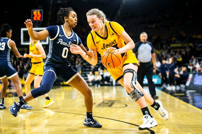 Iowa forward Shateah Wetering, right, drives to the basket as Penn State guard Ivane Tensaie defends during a NCAA Big Ten Conference women's basketball game, Saturday, Jan. 14, 2023, at Carver-Hawkeye Arena in Iowa City, Iowa.
