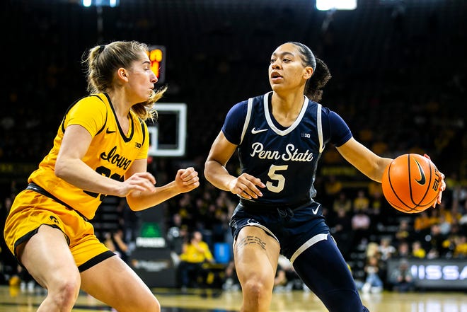 Penn State guard Leilani Kapinus, right, drives to the basket as Iowa guard Kate Martin defends during a NCAA Big Ten Conference women's basketball game, Saturday, Jan. 14, 2023, at Carver-Hawkeye Arena in Iowa City, Iowa.