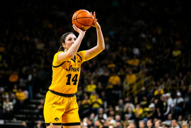 Iowa's McKenna Warnock (14) shoots a free throw during a NCAA Big Ten Conference women's basketball game against Penn State, Saturday, Jan. 14, 2023, at Carver-Hawkeye Arena in Iowa City, Iowa.