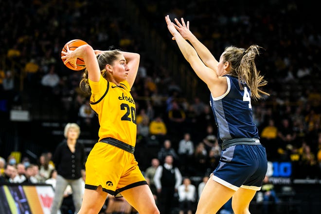 Iowa guard Kate Martin (20) passes the ball as Penn State guard Shay Ciezki defends during a NCAA Big Ten Conference women's basketball game, Saturday, Jan. 14, 2023, at Carver-Hawkeye Arena in Iowa City, Iowa.