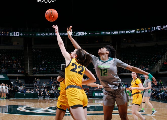 Iowa's Caitlin Clark, left, and Michigan State's Isaline Alexander reach for a rebound, Wednesday, Jan. 18, 2023, in East Lansing.
