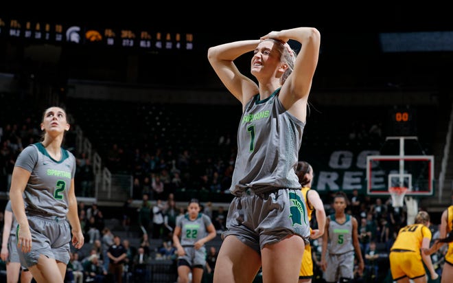 Michigan State's Tory Ozment (1) and Abbey Kimball, left, react as time expires in overtime in a loss against Iowa, Wednesday, Jan. 18, 2023, in East Lansing.