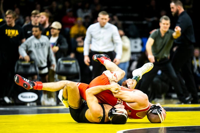 Iowa's Real Woods, left, wrestles Nebraska's Brock Hardy at 141 pounds during a Big Ten Conference men's wrestling dual, Friday, Jan. 20, 2023, at Carver-Hawkeye Arena in Iowa City, Iowa.
