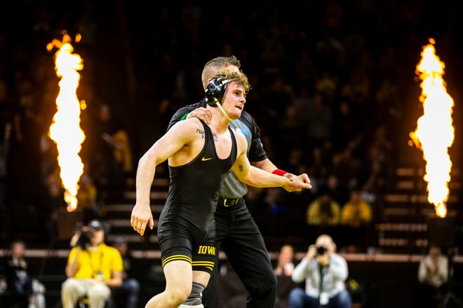 Iowa's Brody Teske has his hand raised after scoring a decision at 133 pounds during a Big Ten Conference men's wrestling dual against Nebraska, Friday, Jan. 20, 2023, at Carver-Hawkeye Arena in Iowa City, Iowa.