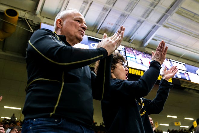 Larry Lee, left, and Cathy Lee, parents of Iowa 125-pound wrestler Spencer Lee, cheer during a Big Ten Conference men's wrestling dual against Nebraska, Friday, Jan. 20, 2023, at Carver-Hawkeye Arena in Iowa City, Iowa.