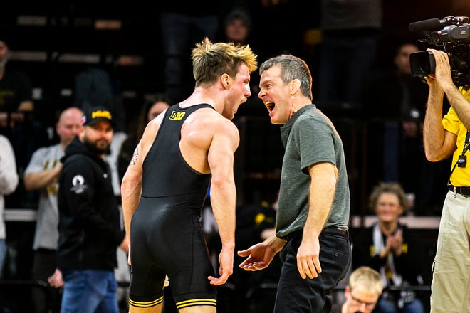 Iowa's Max Murin, left, celebrates with Iowa head coach Tom Brands after scoring a fall at 149 pounds during a Big Ten Conference men's wrestling dual against Nebraska, Friday, Jan. 20, 2023, at Carver-Hawkeye Arena in Iowa City, Iowa.