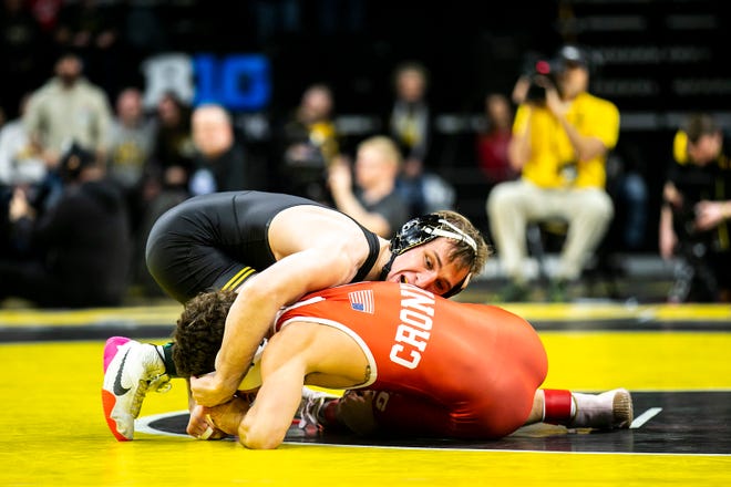 Iowa's Spencer Lee, left, wrestles Nebraska's Liam Cronin at 125 pounds during a Big Ten Conference men's wrestling dual, Friday, Jan. 20, 2023, at Carver-Hawkeye Arena in Iowa City, Iowa.