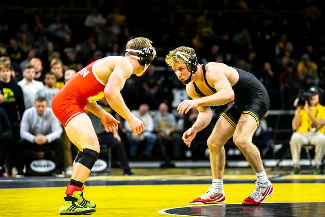 Iowa's Max Murin, right, wrestles Nebraska's Dayne Morton at 149 pounds during a Big Ten Conference men's wrestling dual, Friday, Jan. 20, 2023, at Carver-Hawkeye Arena in Iowa City, Iowa.