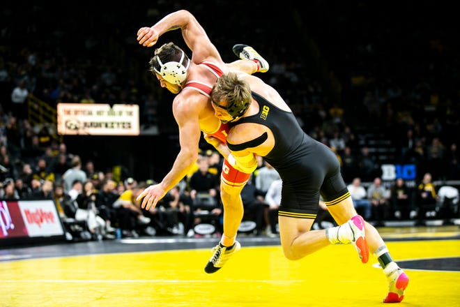 Iowa's Nelson Brands, right, wrestles Nebraska's Mikey Labriola at 174 pounds during a Big Ten Conference men's wrestling dual, Friday, Jan. 20, 2023, at Carver-Hawkeye Arena in Iowa City, Iowa.