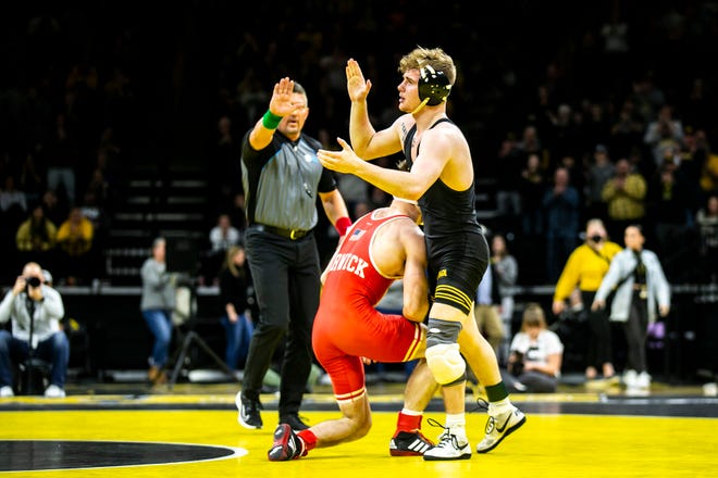 Iowa's Brody Teske, right, reacts after scoring a decision against Nebraska's Kyle Burwick at 133 pounds during a Big Ten Conference men's wrestling dual, Friday, Jan. 20, 2023, at Carver-Hawkeye Arena in Iowa City, Iowa.