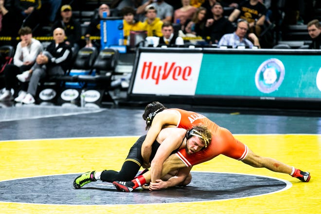 Iowa's Jacob Warner, left, wrestles Nebraska's Silas Allred at 197 pounds during a Big Ten Conference men's wrestling dual, Friday, Jan. 20, 2023, at Carver-Hawkeye Arena in Iowa City, Iowa.