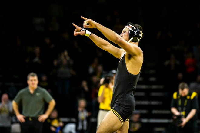Iowa's Real Woods reacts after scoring a decision at 141 pounds during a Big Ten Conference men's wrestling dual against Nebraska, Friday, Jan. 20, 2023, at Carver-Hawkeye Arena in Iowa City, Iowa.