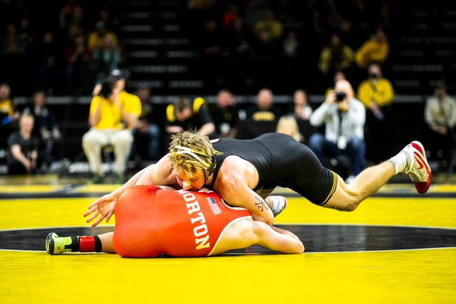 Iowa's Max Murin, right, wrestles Nebraska's Dayne Morton at 149 pounds during a Big Ten Conference men's wrestling dual, Friday, Jan. 20, 2023, at Carver-Hawkeye Arena in Iowa City, Iowa.