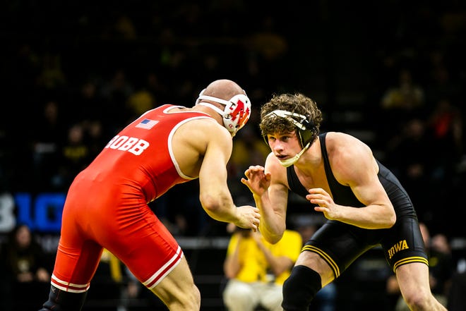 Iowa's Cobe Siebrecht, right, wrestles Nebraska's Peyton Robb at 157 pounds during a Big Ten Conference men's wrestling dual, Friday, Jan. 20, 2023, at Carver-Hawkeye Arena in Iowa City, Iowa.