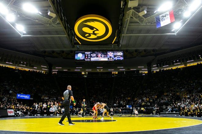 Iowa's Real Woods, right, wrestles Nebraska's Brock Hardy at 141 pounds during a Big Ten Conference men's wrestling dual, Friday, Jan. 20, 2023, at Carver-Hawkeye Arena in Iowa City, Iowa.
