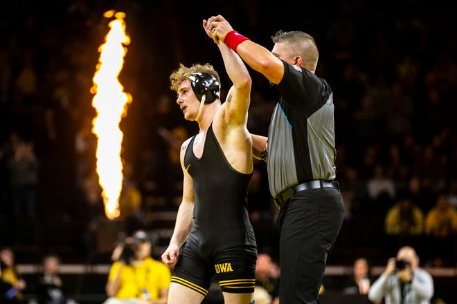 Iowa's Brody Teske has his hand raised after scoring a decision at 133 pounds during a Big Ten Conference men's wrestling dual against Nebraska, Friday, Jan. 20, 2023, at Carver-Hawkeye Arena in Iowa City, Iowa.
