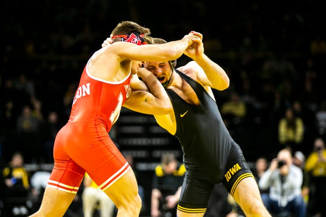Iowa's Patrick Kennedy, right, wrestles Nebraska's Bubba Wilson at 165 pounds during a Big Ten Conference men's wrestling dual, Friday, Jan. 20, 2023, at Carver-Hawkeye Arena in Iowa City, Iowa.