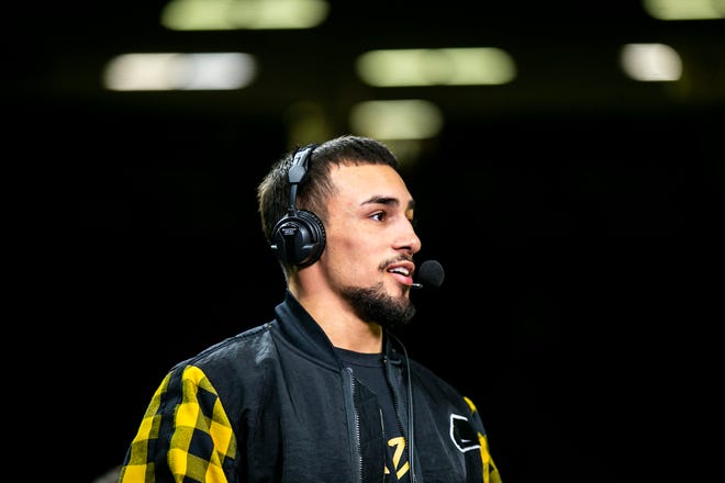 Iowa's Real Woods is interviewed after a Big Ten Conference men's wrestling dual against Nebraska, Friday, Jan. 20, 2023, at Carver-Hawkeye Arena in Iowa City, Iowa.