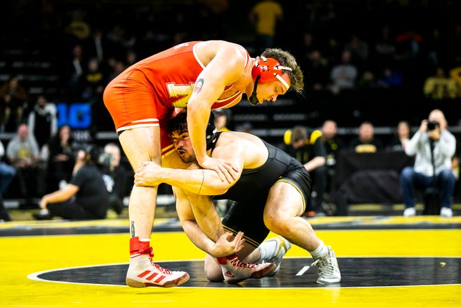 Iowa's Tony Cassioppi, right, wrestles Nebraska's Cale Davidson at 285 pounds during a Big Ten Conference men's wrestling dual, Friday, Jan. 20, 2023, at Carver-Hawkeye Arena in Iowa City, Iowa.