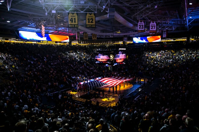 An American flag is displayed while the national anthem is performed before a Big Ten Conference men's wrestling dual between Iowa and Nebraska, Friday, Jan. 20, 2023, at Carver-Hawkeye Arena in Iowa City, Iowa.