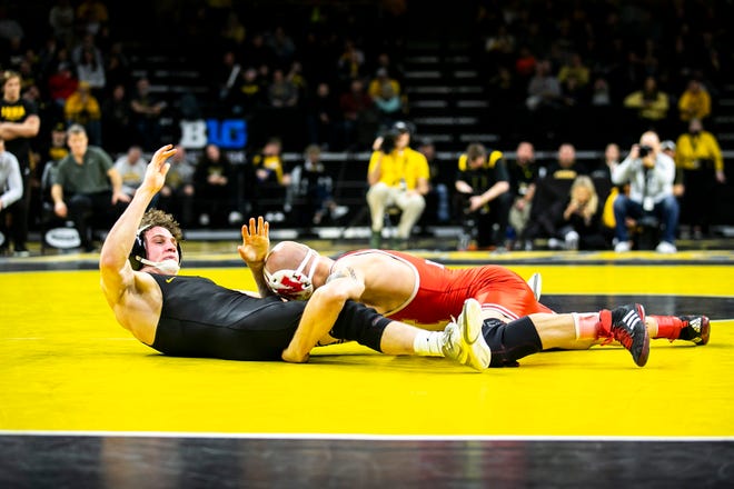 Nebraska's Peyton Robb, right, wrestles Iowa's Cobe Siebrecht at 157 pounds during a Big Ten Conference men's wrestling dual, Friday, Jan. 20, 2023, at Carver-Hawkeye Arena in Iowa City, Iowa.