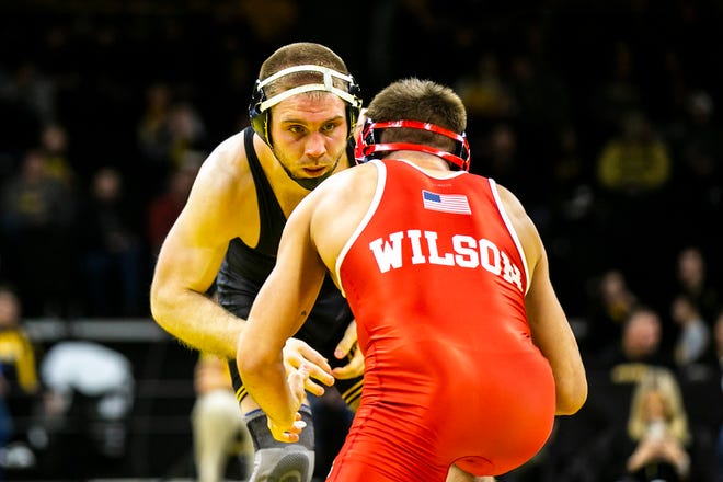 Iowa's Patrick Kennedy, left, wrestles Nebraska's Bubba Wilson at 165 pounds during a Big Ten Conference men's wrestling dual, Friday, Jan. 20, 2023, at Carver-Hawkeye Arena in Iowa City, Iowa.