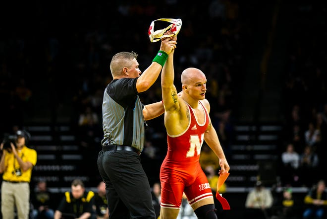 Nebraska's Peyton Robb has his hand raised after scoring a decision at 157 pounds during a Big Ten Conference men's wrestling dual against Iowa, Friday, Jan. 20, 2023, at Carver-Hawkeye Arena in Iowa City, Iowa.