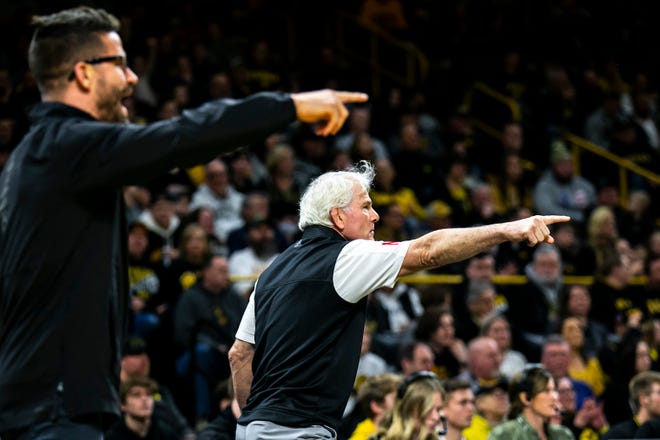 Nebraska associate head coach Bryan Snyder, left, and head coach Mark Manning react during a Big Ten Conference men's wrestling dual against Iowa, Friday, Jan. 20, 2023, at Carver-Hawkeye Arena in Iowa City, Iowa.