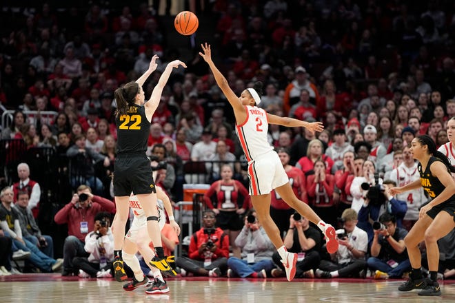 Jan 23, 2023; Columbus, OH, USA;  Iowa Hawkeyes guard Caitlin Clark (22) shoots a three pointer over Ohio State Buckeyes forward Taylor Thierry (2) during the second half of the NCAA women's basketball game at Value City Arena. Ohio State lost 83-72. Mandatory Credit: Adam Cairns-The Columbus Dispatch