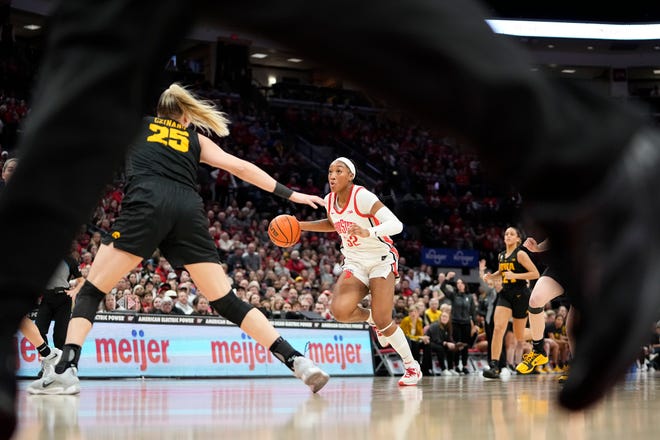 Jan 23, 2023; Columbus, OH, USA;  Ohio State Buckeyes forward Cotie McMahon (32) brings the ball up court toward Iowa Hawkeyes forward Monika Czinano (25) during the second half of the NCAA women's basketball game at Value City Arena. Ohio State lost 83-72. Mandatory Credit: Adam Cairns-The Columbus Dispatch