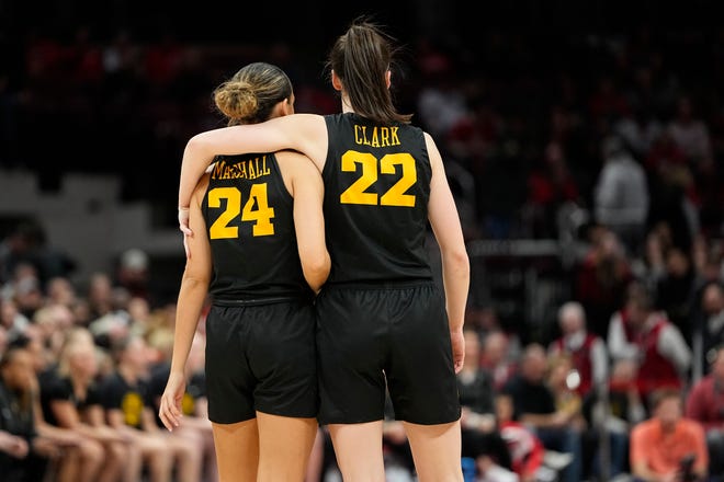 Jan 23, 2023; Columbus, OH, USA;  Iowa Hawkeyes guard Caitlin Clark (22) puts her arm around guard Gabbie Marshall (24) din the final seconds of the second half of the NCAA women's basketball game against the Ohio State Buckeyes at Value City Arena. Ohio State lost 83-72. Mandatory Credit: Adam Cairns-The Columbus Dispatch