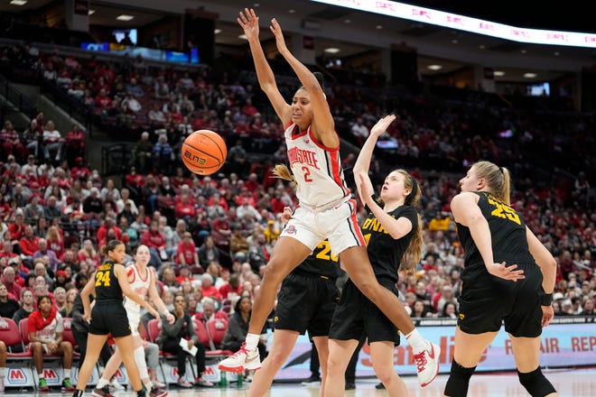 Jan 23, 2023; Columbus, OH, USA;  Iowa Hawkeyes forward Monika Czinano (25) strips the ball from Ohio State Buckeyes forward Taylor Thierry (2) as she goes to the basket during the second half of the NCAA women's basketball game at Value City Arena. Ohio State lost 83-72. Mandatory Credit: Adam Cairns-The Columbus Dispatch