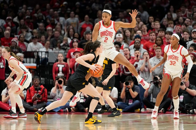 Jan 23, 2023; Columbus, OH, USA;  Ohio State Buckeyes forward Taylor Thierry (2) defends Iowa Hawkeyes guard Caitlin Clark (22) during the second half of the NCAA women's basketball game at Value City Arena. Ohio State lost 83-72. Mandatory Credit: Adam Cairns-The Columbus Dispatch