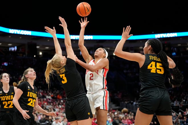 Jan 23, 2023; Columbus, OH, USA;  Ohio State Buckeyes forward Taylor Thierry (2) shoots a floater over Iowa Hawkeyes guard Sydney Affolter (3) and forward Hannah Stuelke (45) during the first half of the NCAA women's basketball game at Value City Arena. Ohio State lost 83-72. Mandatory Credit: Adam Cairns-The Columbus Dispatch