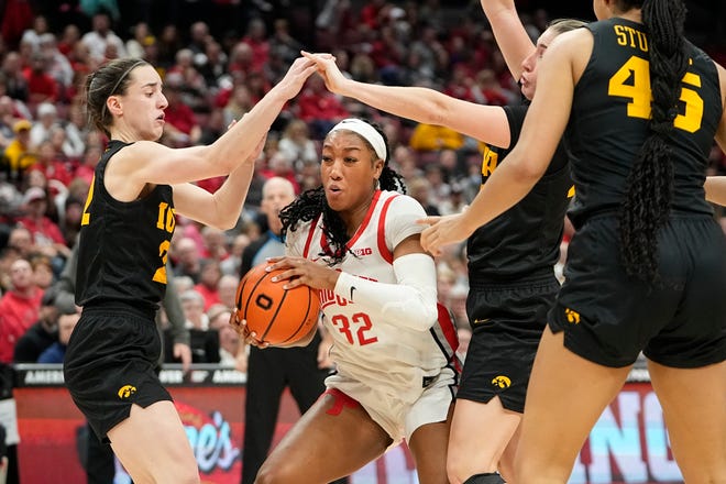 Jan 23, 2023; Columbus, OH, USA;  Ohio State Buckeyes forward Cotie McMahon (32) maneuvers around Iowa Hawkeyes guard Caitlin Clark (22) during the second half of the NCAA women's basketball game at Value City Arena. Ohio State lost 83-72. Mandatory Credit: Adam Cairns-The Columbus Dispatch