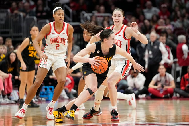 Jan 23, 2023; Columbus, OH, USA;  Iowa Hawkeyes guard Caitlin Clark (22) dribbles around Ohio State Buckeyes guard Taylor Mikesell (24) during the second half of the NCAA women's basketball game at Value City Arena. Ohio State lost 83-72. Mandatory Credit: Adam Cairns-The Columbus Dispatch