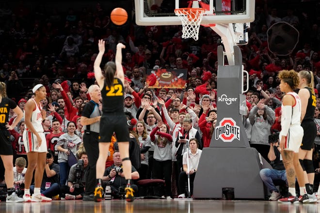 Jan 23, 2023; Columbus, OH, USA;  Ohio State students try to distract Iowa Hawkeyes guard Caitlin Clark (22) as she shoots free throws during the second half of the NCAA women's basketball game at Value City Arena. Ohio State lost 83-72. Mandatory Credit: Adam Cairns-The Columbus Dispatch