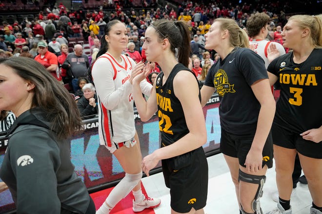 Jan 23, 2023; Columbus, OH, USA;  Ohio State Buckeyes forward Rebeka Mikulasikova (23) shakes hands with Iowa Hawkeyes guard Caitlin Clark (22) following the NCAA women's basketball game at Value City Arena. Ohio State lost 83-72. Mandatory Credit: Adam Cairns-The Columbus Dispatch