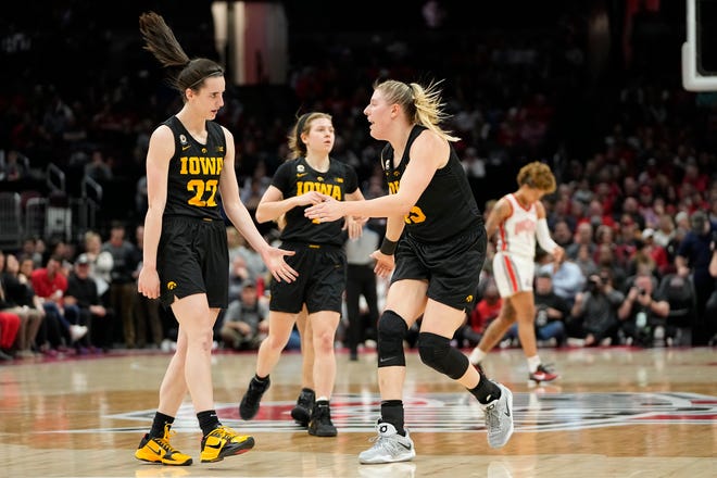 Jan 23, 2023; Columbus, OH, USA;  Iowa Hawkeyes guard Caitlin Clark (22) celebrates a three pointer with forward Monika Czinano (25) during the first half of the NCAA women's basketball game against the Ohio State Buckeyes at Value City Arena. Mandatory Credit: Adam Cairns-The Columbus Dispatch