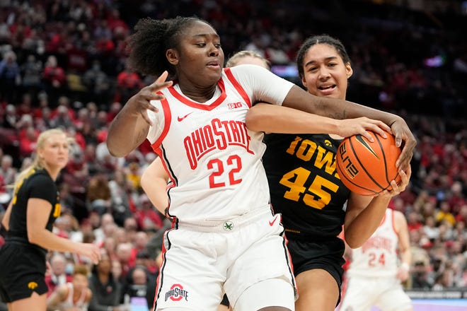 Jan 23, 2023; Columbus, OH, USA;  Ohio State Buckeyes forward Eboni Walker (22) fights for a ball with Iowa Hawkeyes forward Hannah Stuelke (45) during the second half of the NCAA women's basketball game at Value City Arena. Ohio State lost 83-72. Mandatory Credit: Adam Cairns-The Columbus Dispatch
