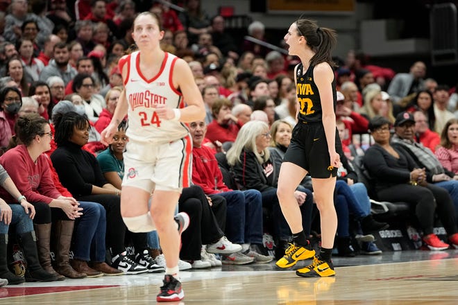 Jan 23, 2023; Columbus, OH, USA;  Iowa Hawkeyes guard Caitlin Clark (22) celebrates a three pointer behind Ohio State Buckeyes guard Taylor Mikesell (24) during the first half of the NCAA women's basketball game at Value City Arena. Mandatory Credit: Adam Cairns-The Columbus Dispatch