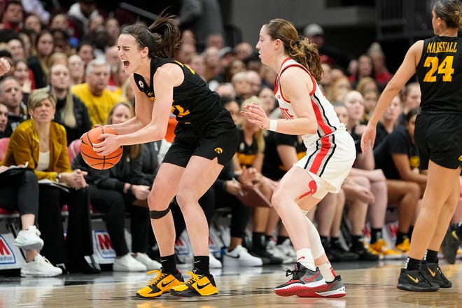 Jan 23, 2023; Columbus, OH, USA;  Iowa Hawkeyes guard Caitlin Clark (22) draws a foul from Ohio State Buckeyes guard Taylor Mikesell (24) during the second half of the NCAA women's basketball game at Value City Arena. Ohio State lost 83-72. Mandatory Credit: Adam Cairns-The Columbus Dispatch