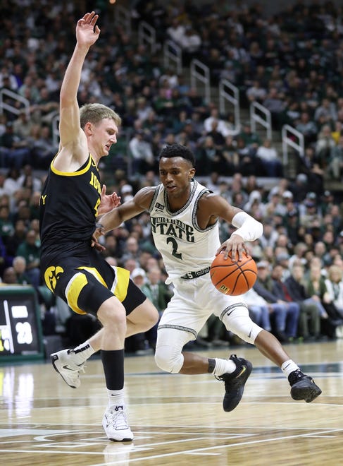 Michigan State guard Tyson Walker drives against Iowa guard Josh Dix during the first half of MSU's 63-61 win on Thursday, Jan. 26, 2023, at Breslin Center.