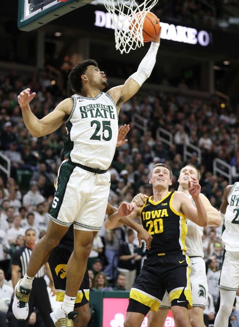 Michigan State forward Malik Hall rebounds against Iowa forward Payton Sandfort during the second half of MSU's 63-61 win on Thursday, Jan. 26, 2023, at Breslin Center.